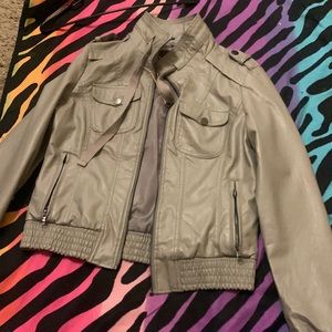 This is a greenish color jacket nice color and cute .